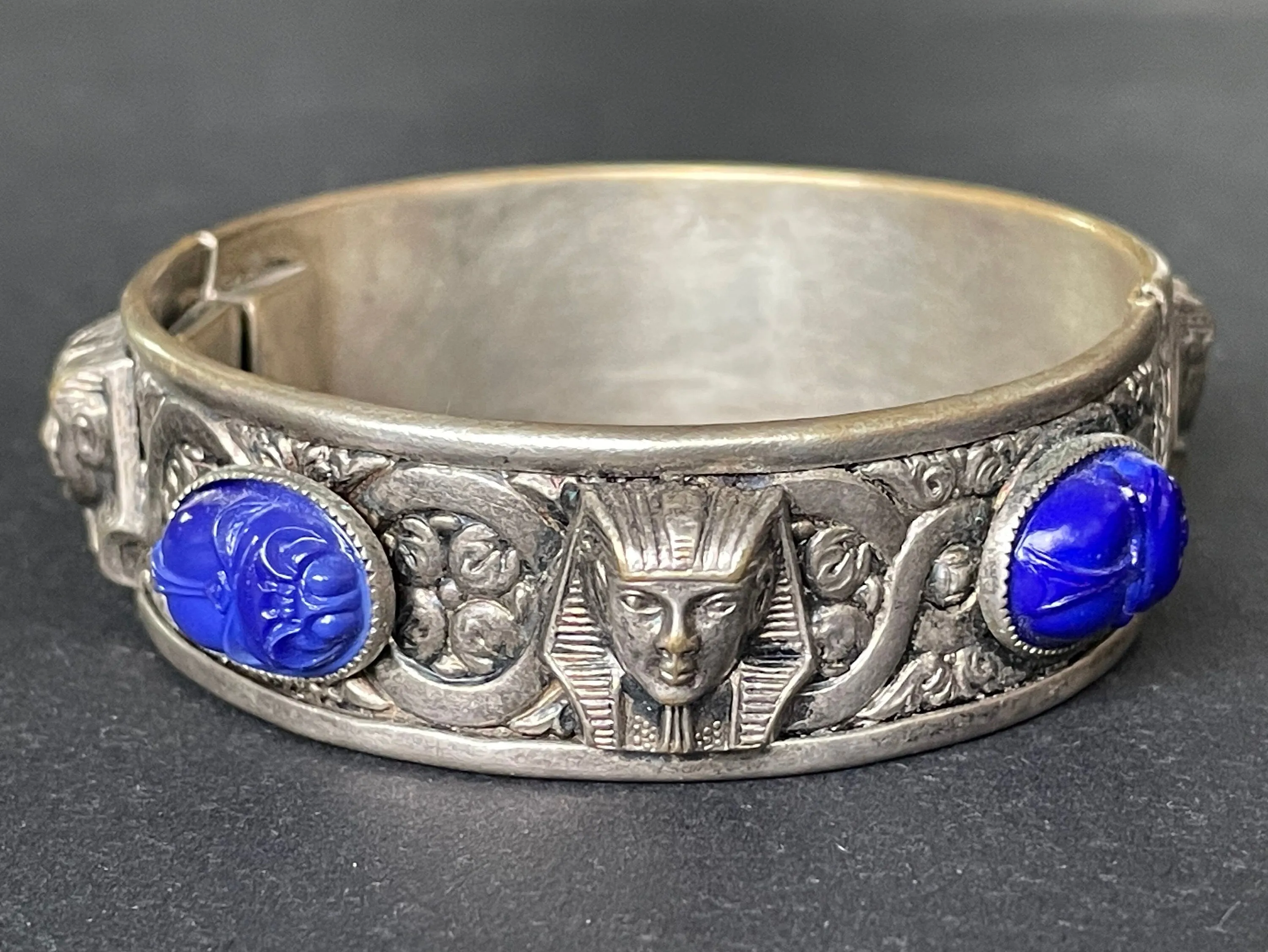 Vintage Egyptian revival Tutankhamun pharaoh and scarab beetle silver tone bangle, blue glass (faux lapis lazuli) scarab cabochons, Czech ?