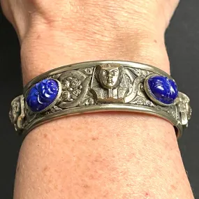 Vintage Egyptian revival Tutankhamun pharaoh and scarab beetle silver tone bangle, blue glass (faux lapis lazuli) scarab cabochons, Czech ?