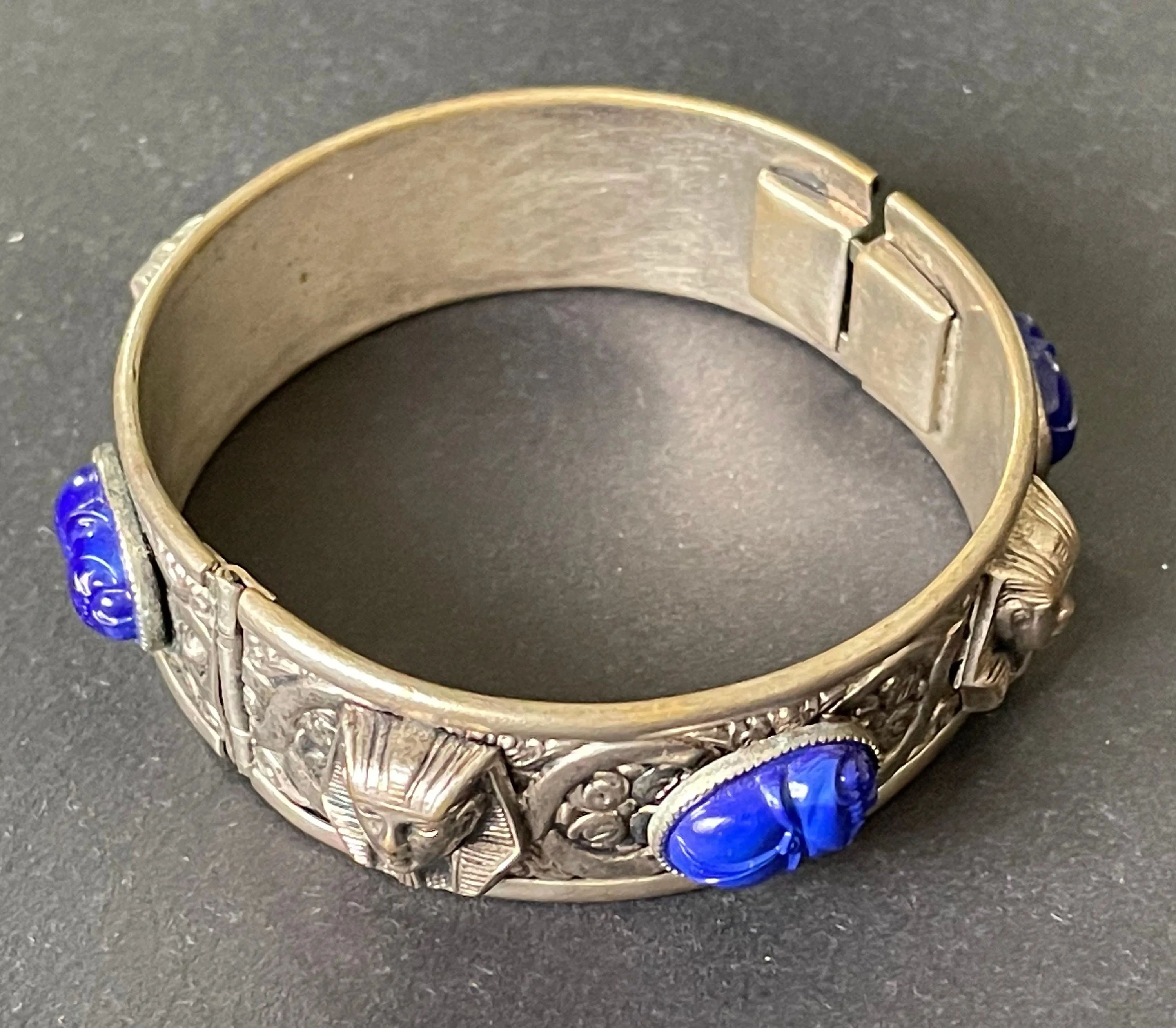 Vintage Egyptian revival Tutankhamun pharaoh and scarab beetle silver tone bangle, blue glass (faux lapis lazuli) scarab cabochons, Czech ?